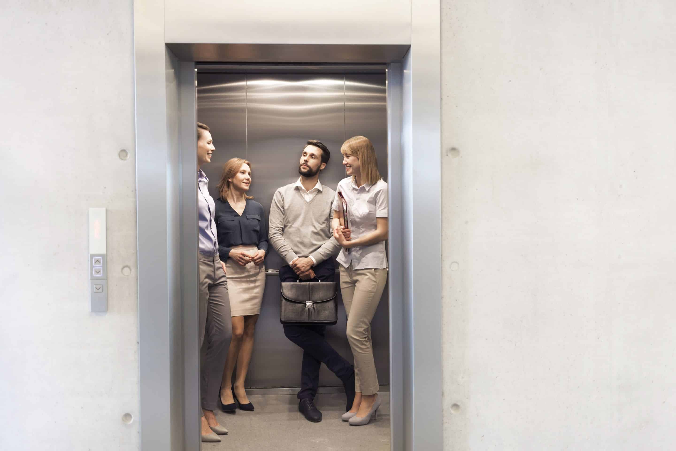 Business employees standing in an elevator